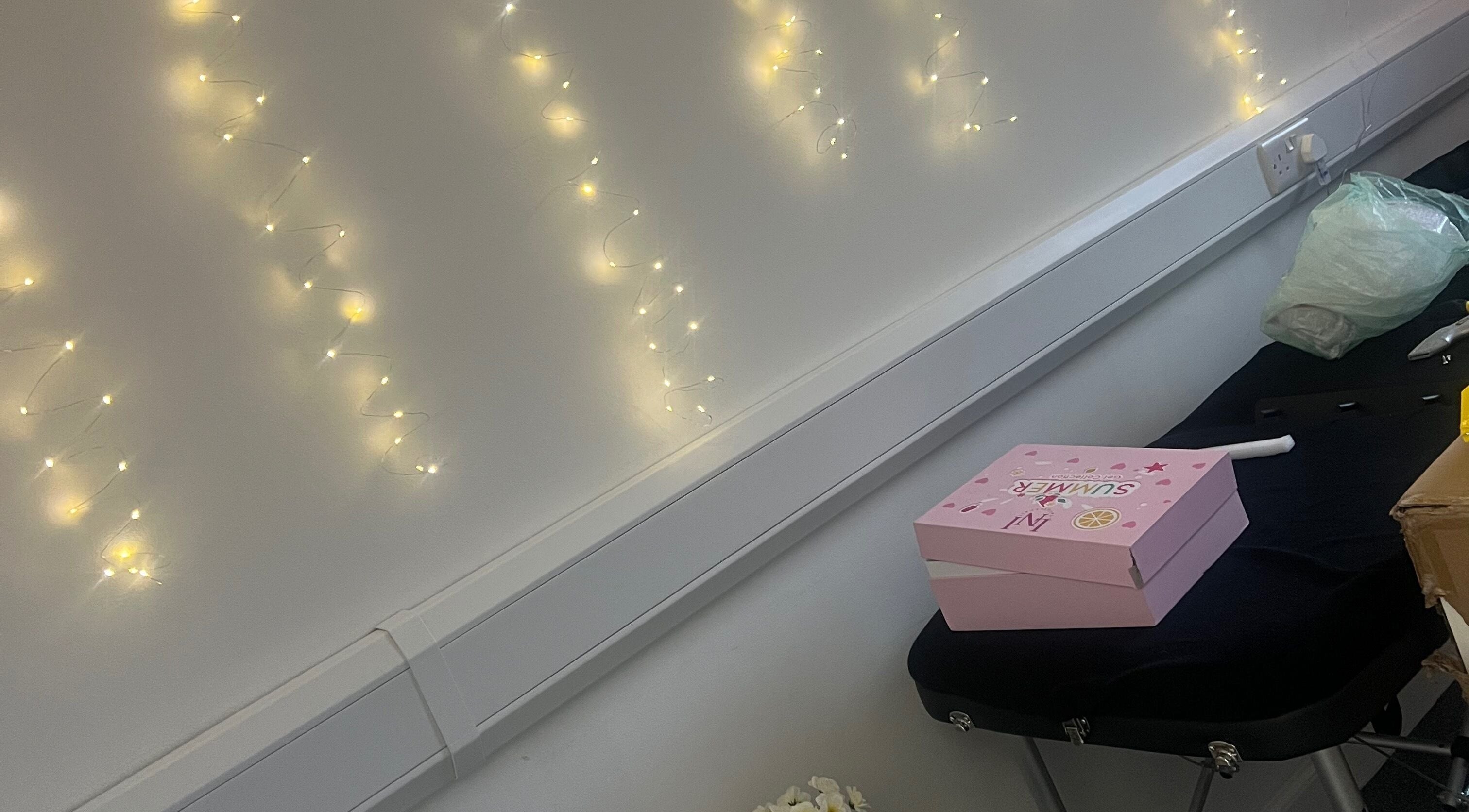 Luna Glow in Edinburgh, Scotland, GB featuring soft fairy lights and a pink box on a massage table.