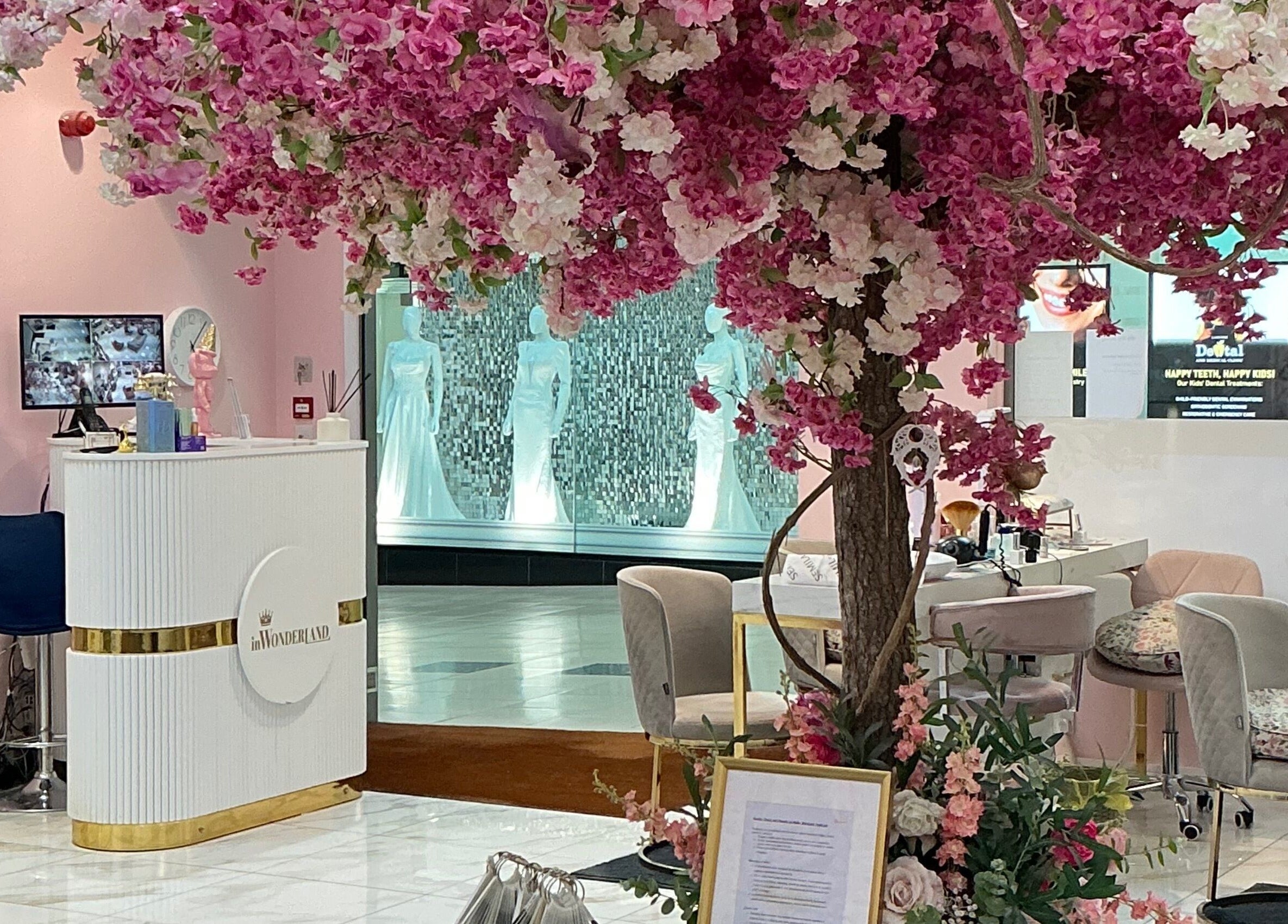 InWonderland Lakeside in Grays, England, GB, features elegant cherry blossoms in a chic reception area.