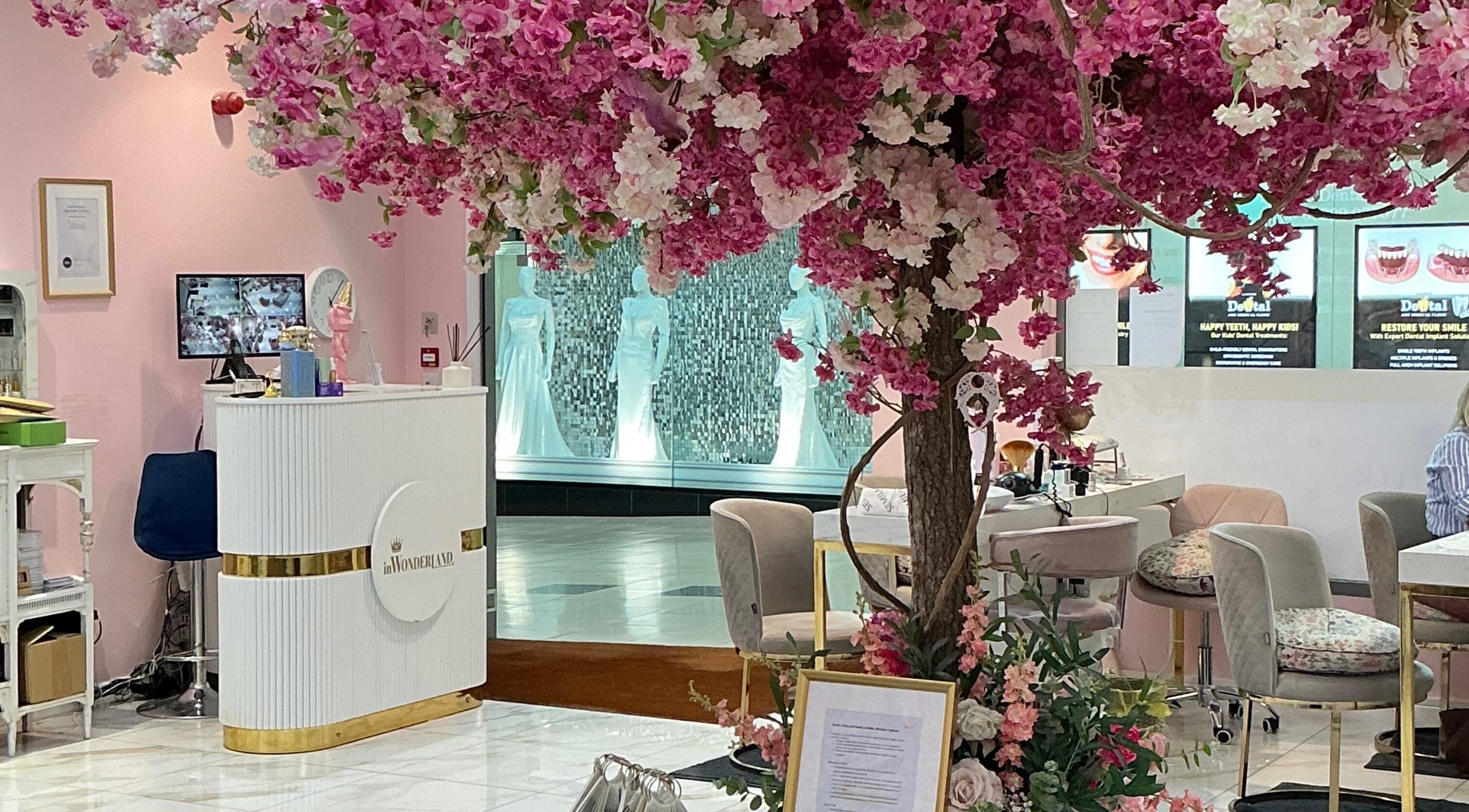 InWonderland Lakeside in Grays, England, GB, features elegant cherry blossoms in a chic reception area.