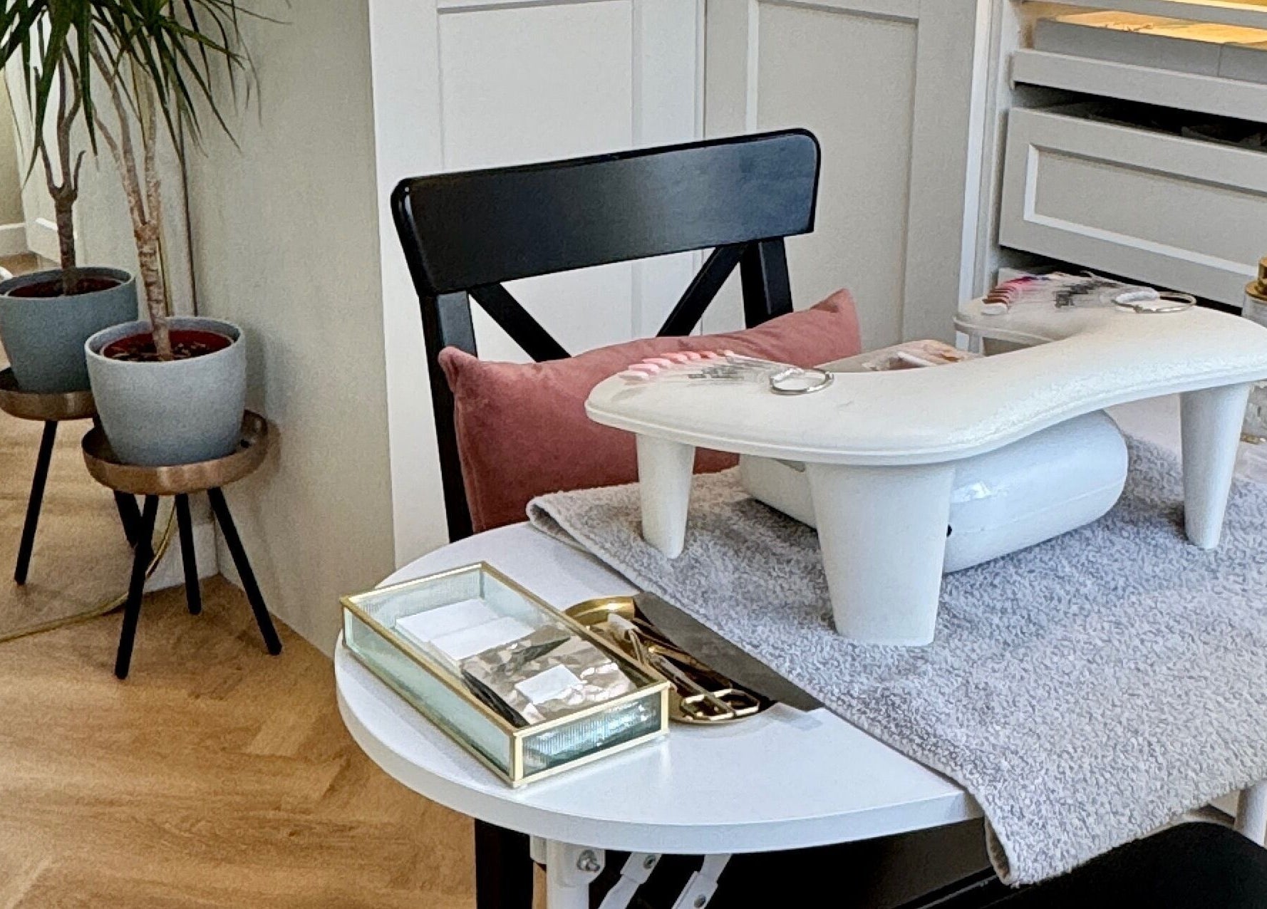 Elegant manicure station at Nova Noir Nails, Peacehaven, England, GB, showcasing stylish decor and equipment.