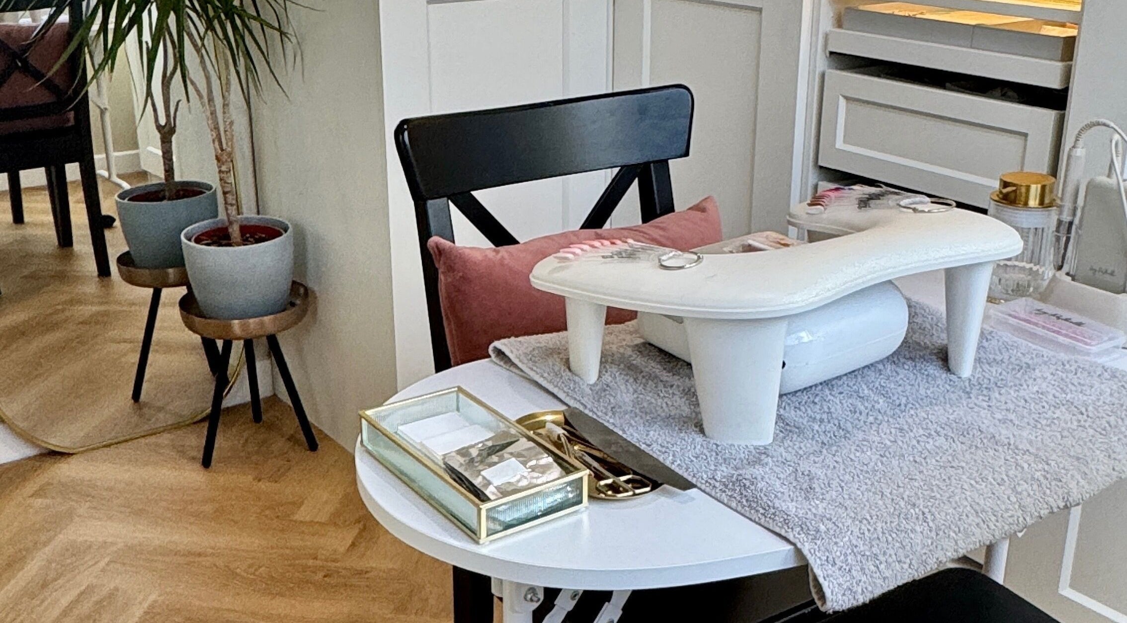 Elegant manicure station at Nova Noir Nails, Peacehaven, England, GB, showcasing stylish decor and equipment.