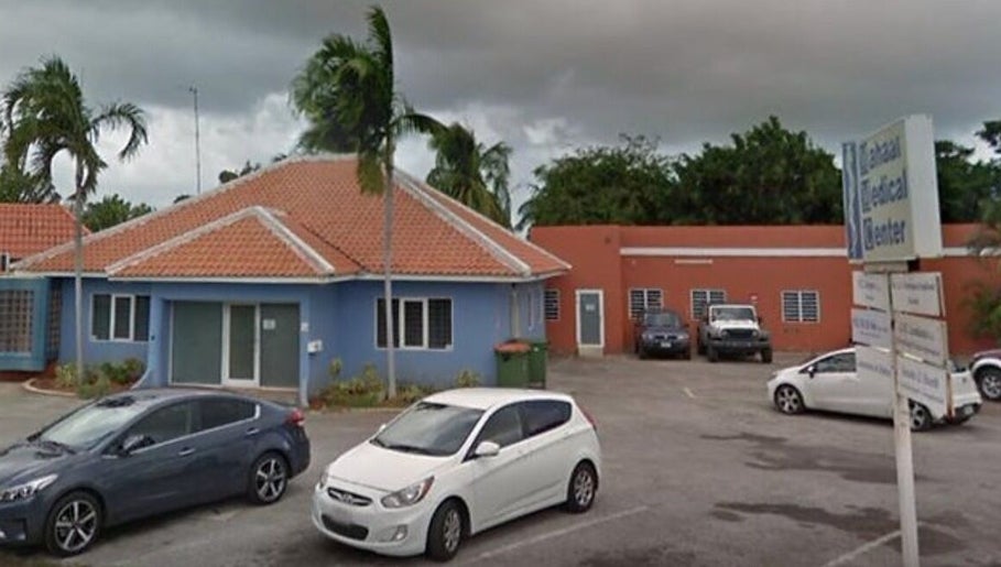 Exterior view of Glow by Amarii, a wellness center in Willemstad, CW, showcasing tropical architecture.