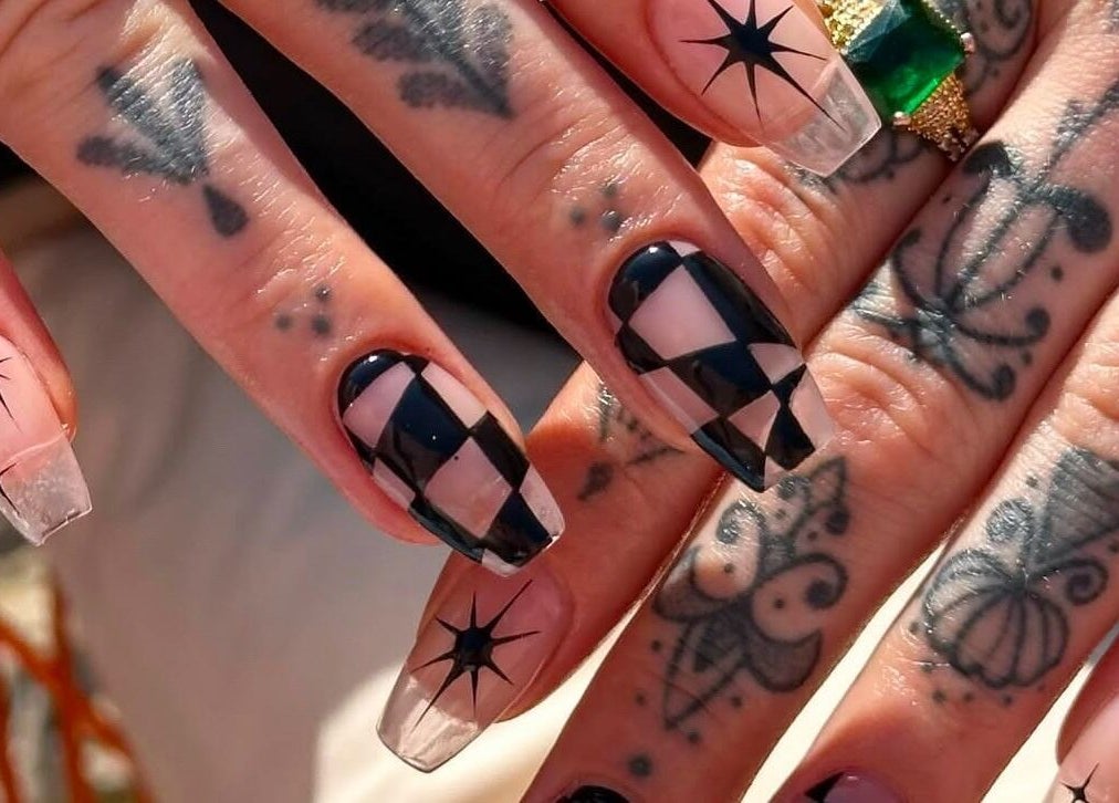 Unique geometric nail art at Gorgia Nails in Yate, England, GB, showcasing intricate designs and tattoos.