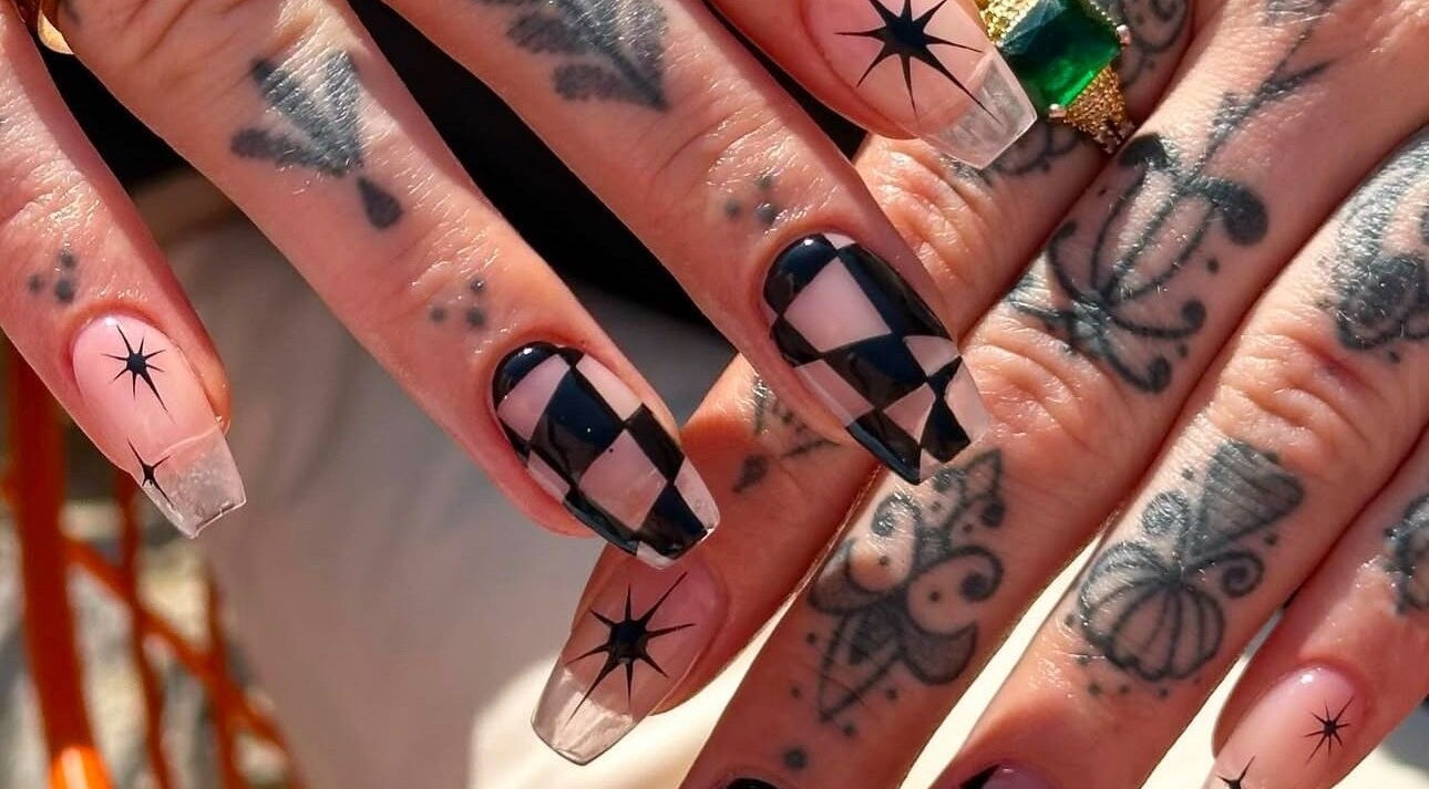 Unique geometric nail art at Gorgia Nails in Yate, England, GB, showcasing intricate designs and tattoos.