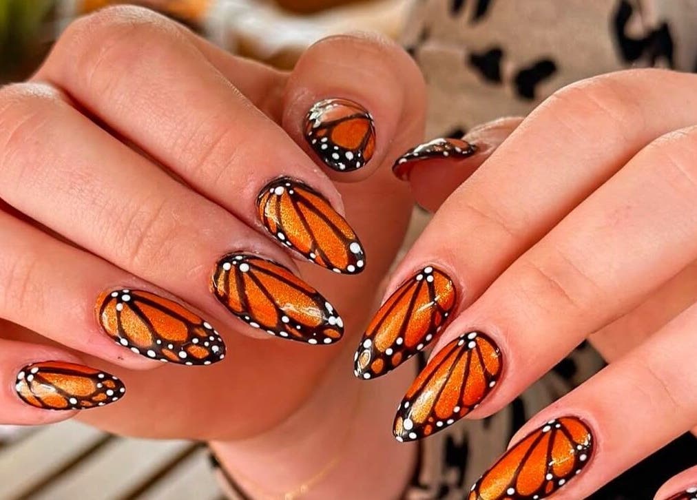 Intricate butterfly nail art at Gorgia Nails, Yate, England, GB offering vibrant, creative designs.