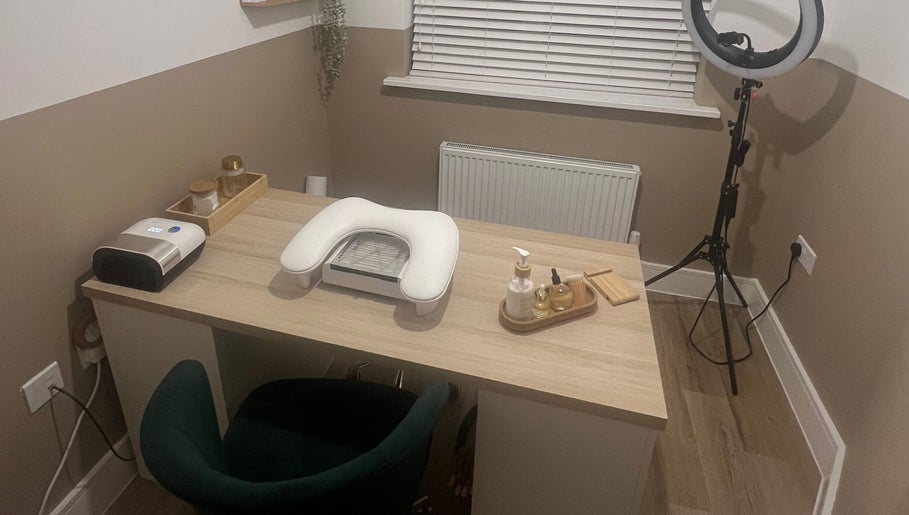 Cozy nail station at DLBeauty in Branston, England, GB featuring a manicure table with modern equipment.