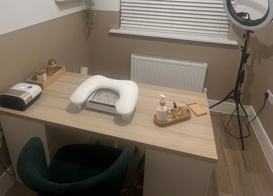 Cozy nail station at DLBeauty in Branston, England, GB featuring a manicure table with modern equipment.