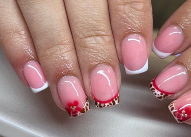 Elegant nail art with pink and red designs at The Beauty Office, Nuneaton, England, GB.