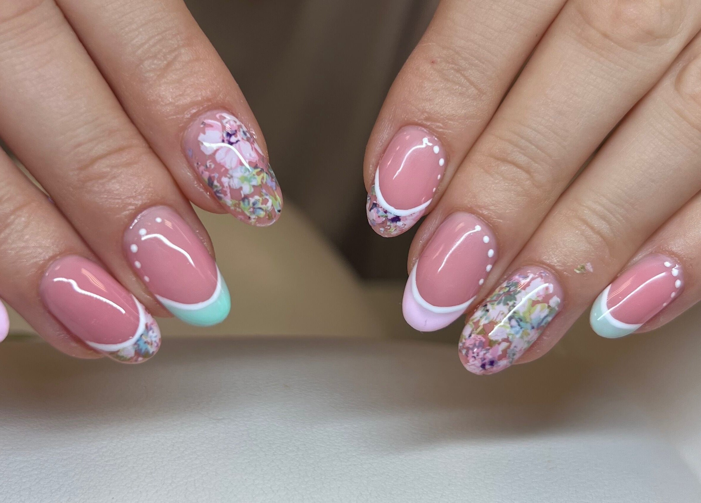 Beautiful floral nail art at The Beauty Office, Nuneaton, England, GB. Elegant pink and white manicure.