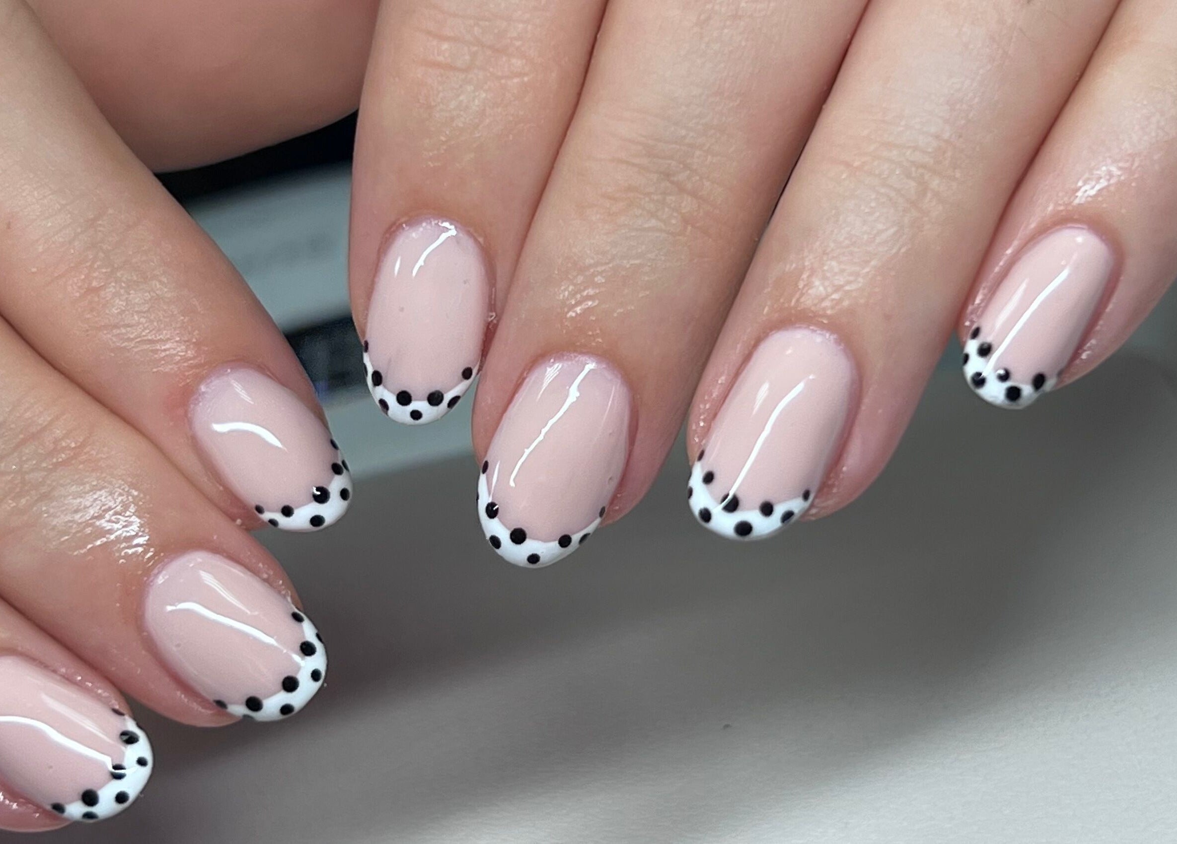 Polka dot nail art at The Beauty Office, Nuneaton, England, GB. Chic and stylish manicure design.