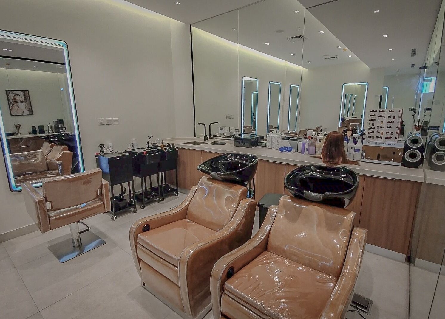 Modern salon interior at Women Address in Riyadh, Riyadh Province, SA with sleek chairs and elegant mirrors.