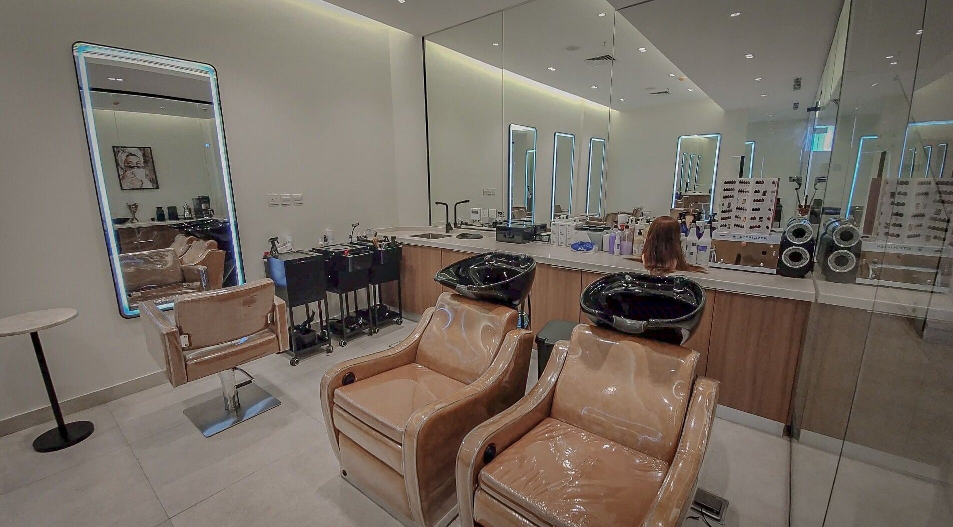 Modern salon interior at Women Address in Riyadh, Riyadh Province, SA with sleek chairs and elegant mirrors.