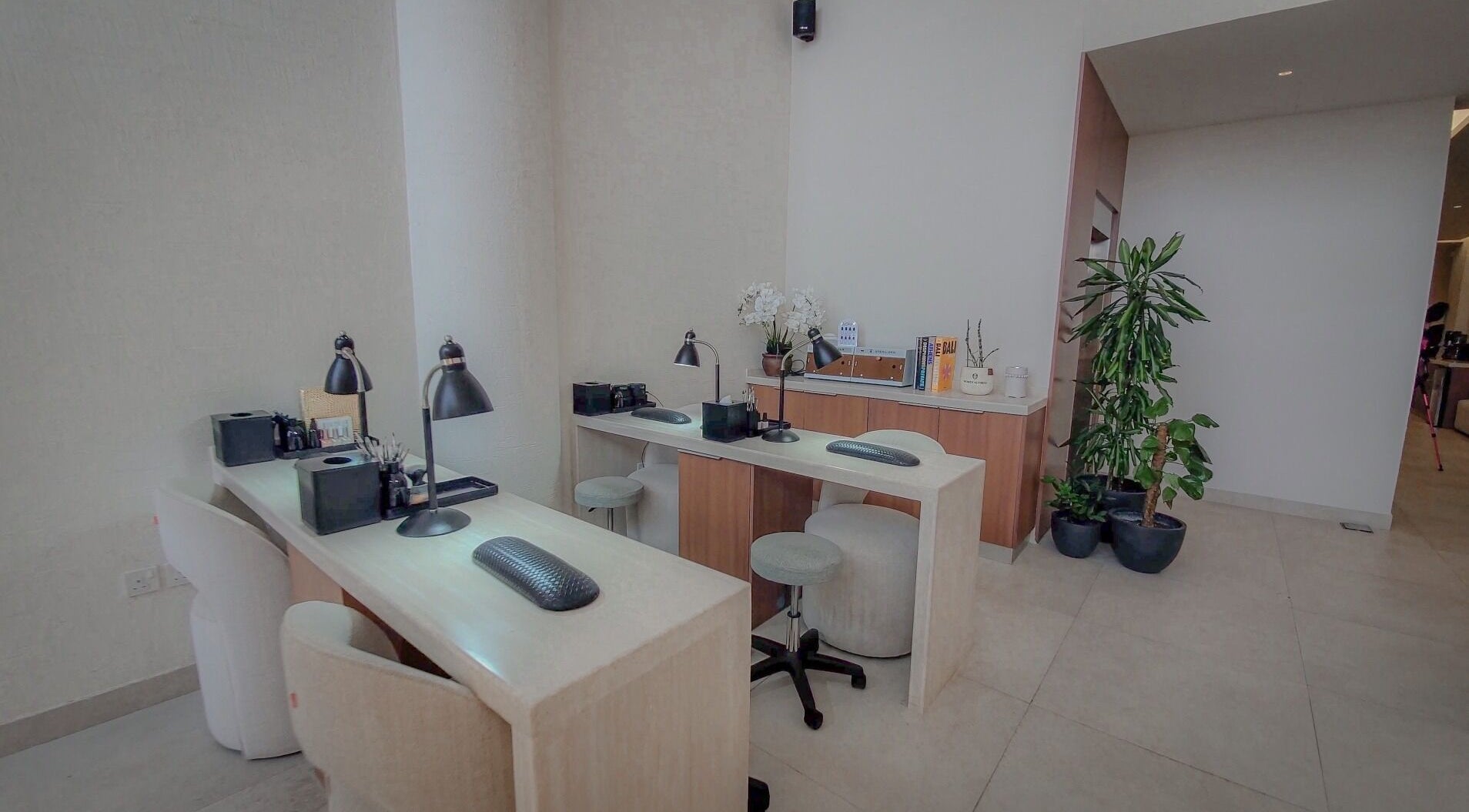 Modern nail station at Women Address, Riyadh, Riyadh Province, SA, featuring sleek design and comfortable seating.