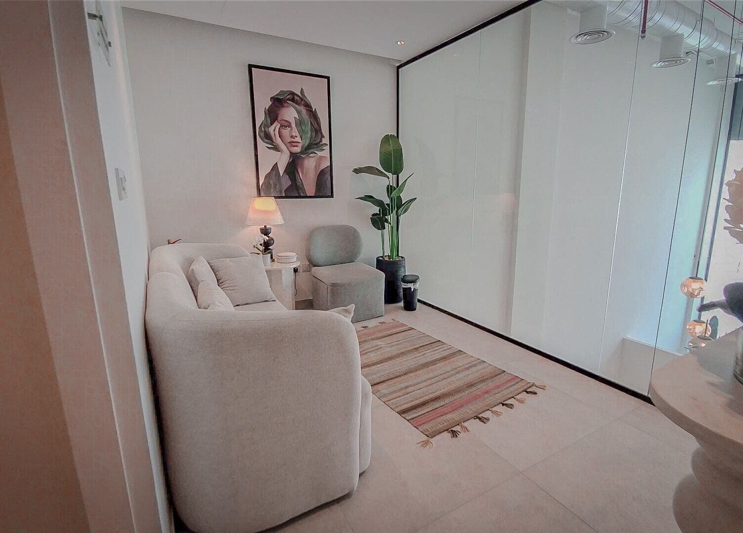 Elegant lounge area at Women Address in Riyadh with plush seating and modern decor.