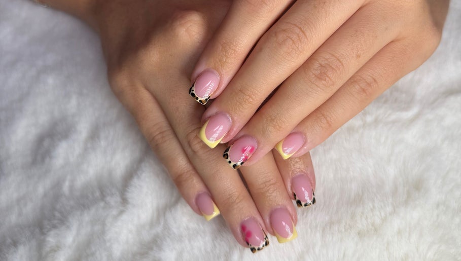 Elegant nail art with pink and leopard tips by Byabbyrae in Hyde, England, GB.