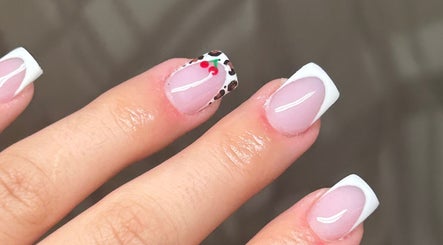 Chic nail art at Byabbyrae, Hyde, England, GB featuring white tips and cherry design.