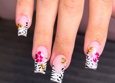 Stylish zebra and floral nail art from Byabbyrae in Hyde, England, GB, showcasing intricate design.