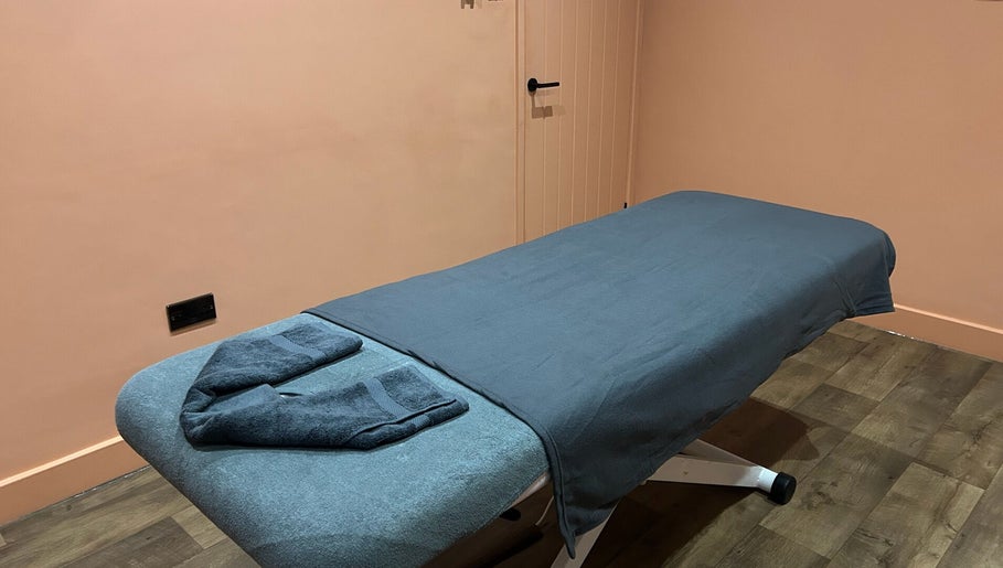 Tranquil massage room at Alex Massage Therapies, Bristol, England, GB. Features cozy massage table and soft lighting.