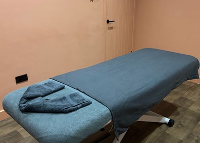 Tranquil massage room at Alex Massage Therapies, Bristol, England, GB. Features cozy massage table and soft lighting.