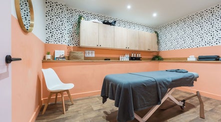 Cozy massage room at Alex Massage Therapies in Bristol, England, GB with modern decor and warm lighting.