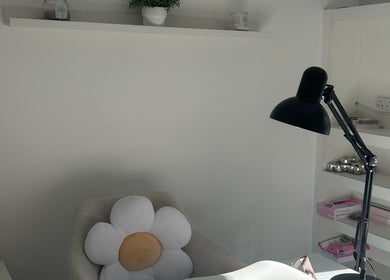 Cozy nail treatment space at Nails by Daisy in Doncaster, England, GB, with a daisy pillow and sleek lamp.