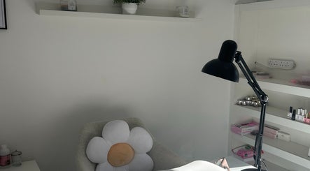 Cozy nail treatment space at Nails by Daisy in Doncaster, England, GB, with a daisy pillow and sleek lamp.