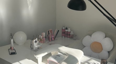 Elegant manicure station at Nails by Daisy in Doncaster, England, GB, featuring a cozy flower-shaped pillow.