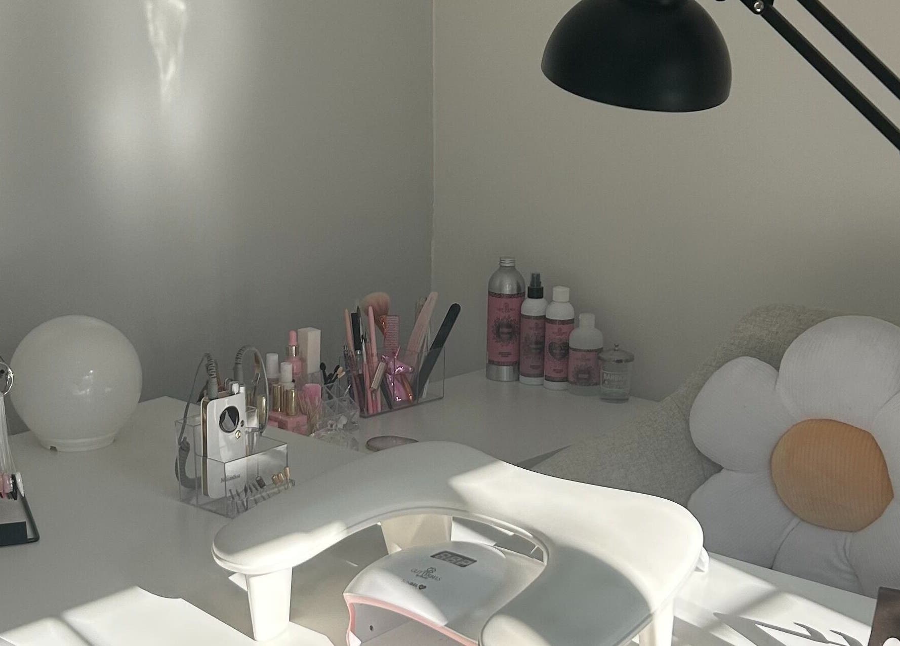 Elegant nail station at Nails by Daisy, Doncaster, England, GB featuring stylish tools and floral decor.