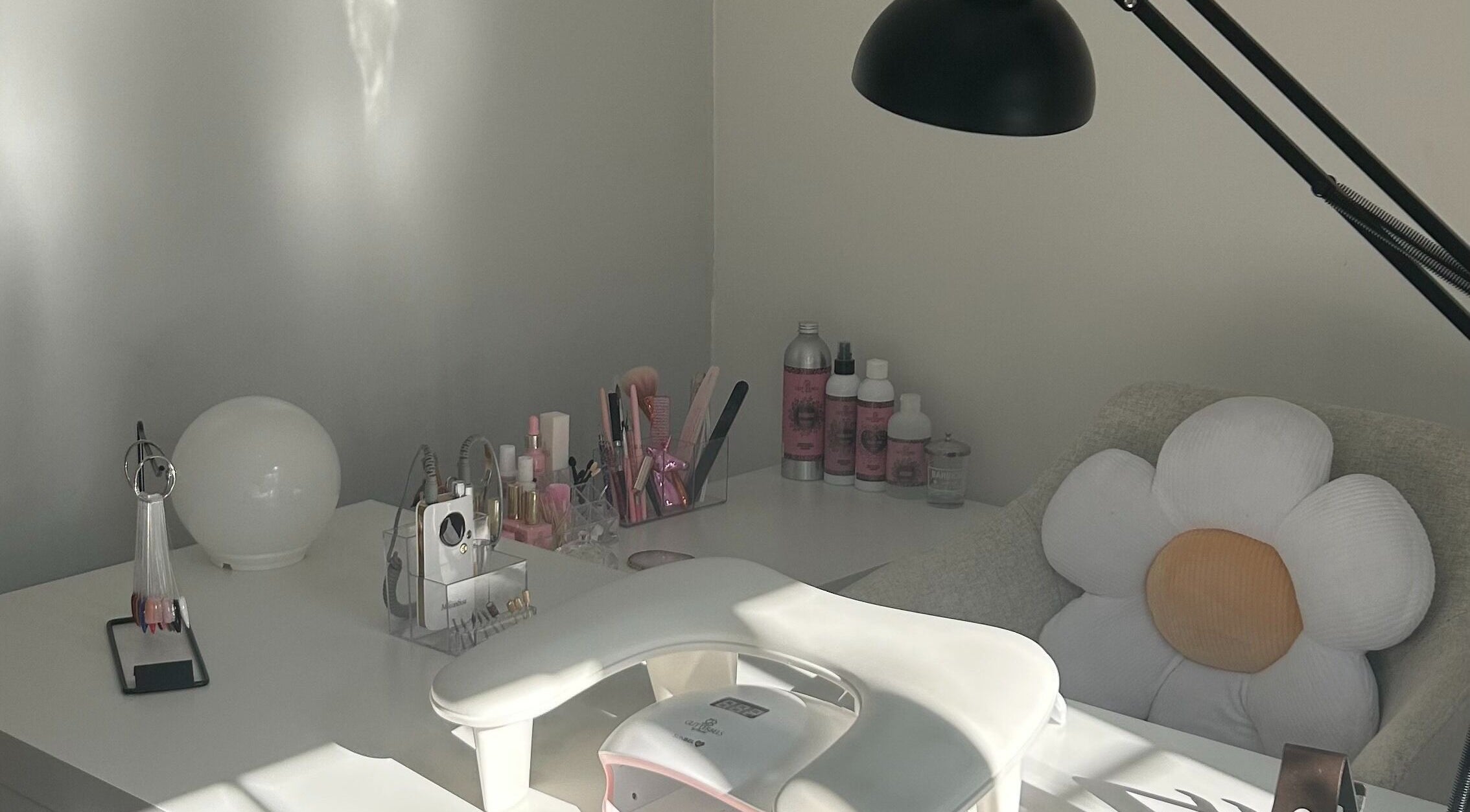 Elegant nail station at Nails by Daisy, Doncaster, England, GB featuring stylish tools and floral decor.