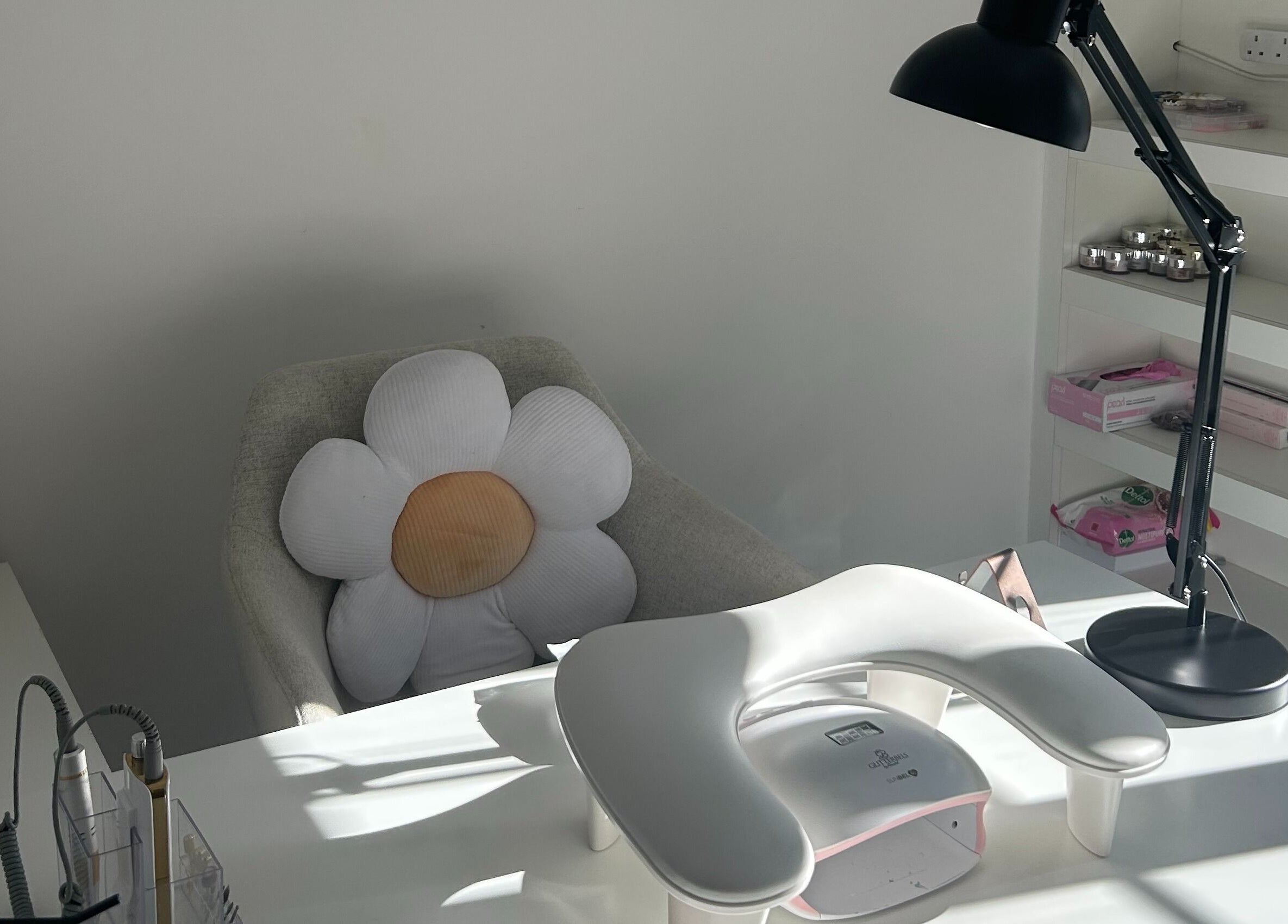 Cozy nail station at Nails by Daisy, Doncaster, England, GB with a floral cushion and manicure setup.