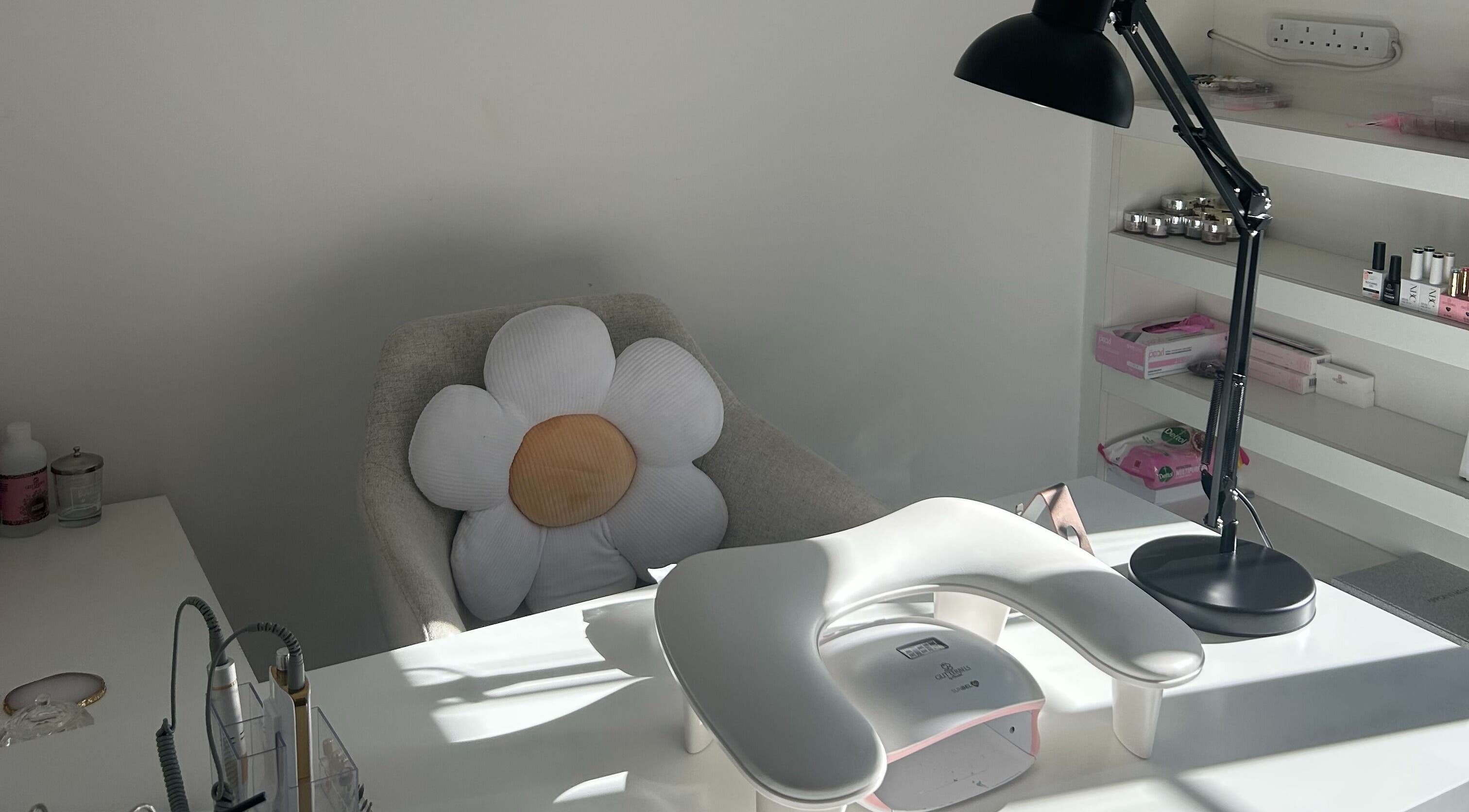 Cozy nail station at Nails by Daisy, Doncaster, England, GB with a floral cushion and manicure setup.