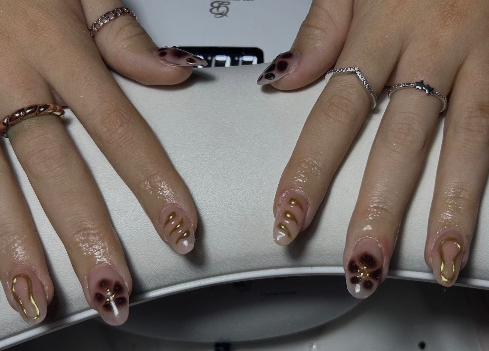 Elegant nail art with gold accents by Nails by Daisy in Doncaster, England, GB.