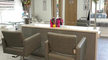 Interior of Helen Seaton Hairdressing in Liverpool, England, GB showcasing modern salon chairs and styling area.