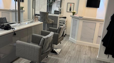 Modern salon chairs and sleek styling area at Helen Seaton Hairdressing, Liverpool, England, GB.