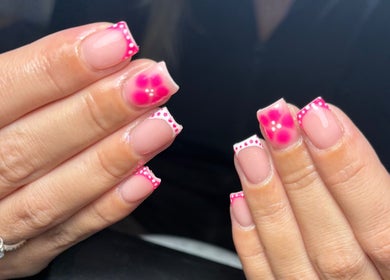 Elegant floral nail art at JW Beauty, Tyldesley, England, GB. Perfect for personal style enhancement.