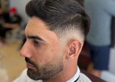 Close-up of a sleek fade haircut at Nilson|Barbeiro, Dublin, County Dublin, IE, showcasing professional grooming.