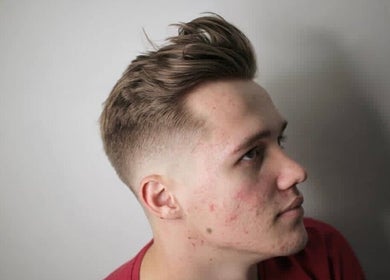 Stylish men's haircut at Tamus in Dublin, County Dublin, IE, showcasing a trendy fade style.