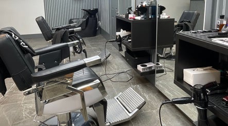 Modern salon chairs and equipment at Tamus, Dublin, County Dublin, IE, showcasing professional styling setup.