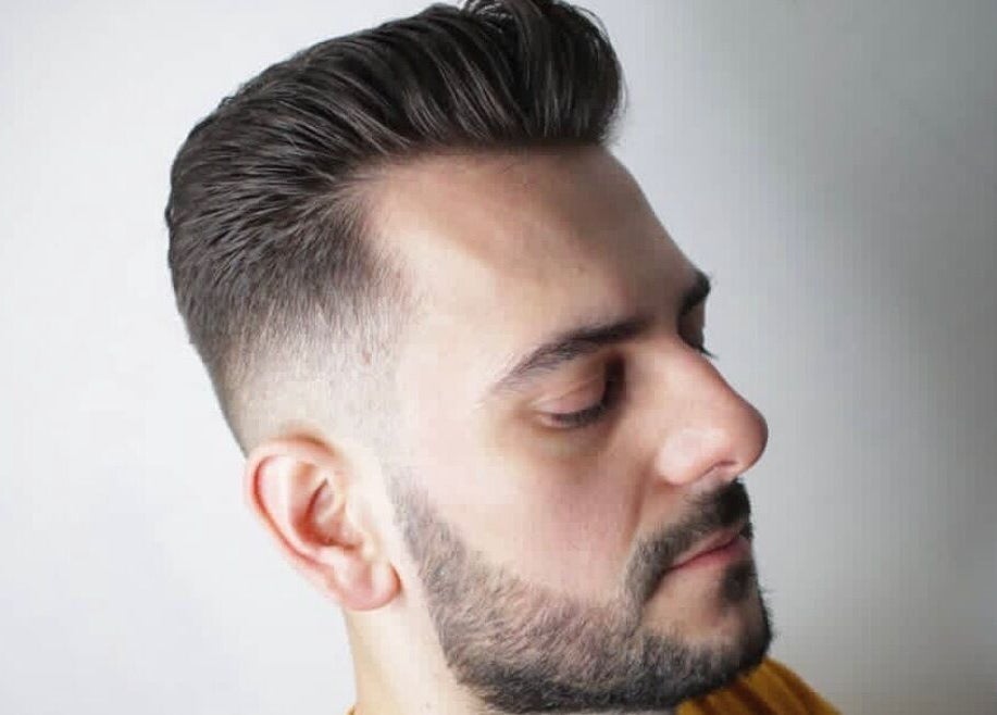 Stylish male haircut at Tamus, Dublin, County Dublin, IE, featuring a clean fade and sharp beard.