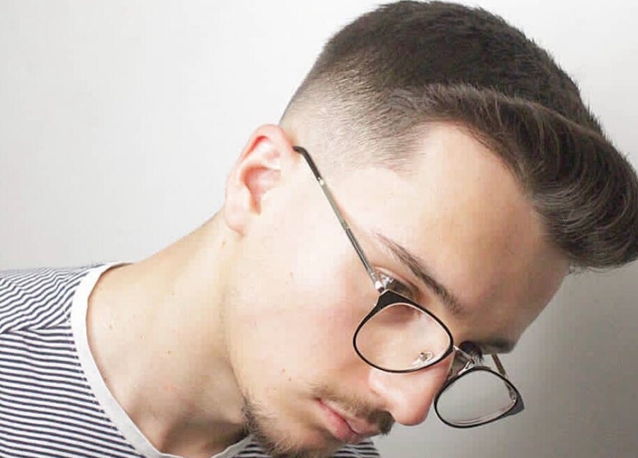 Modern haircut style at Tamus, Dublin, County Dublin, IE, showcasing a fresh fade hairstyle.