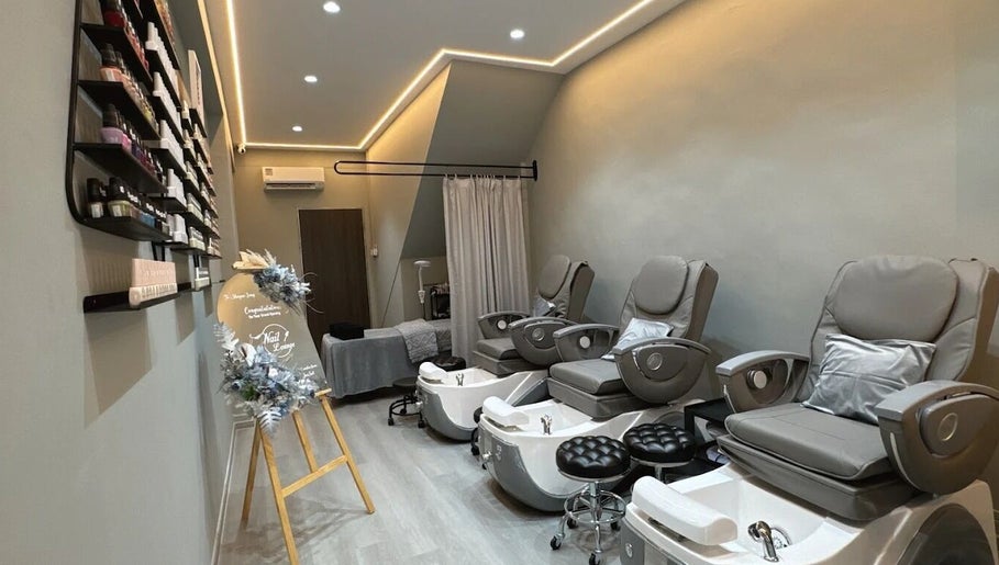 Relaxing interior of Nail Lounge in Singapore, Singapore, SG with plush pedicure chairs and elegant ambiance.