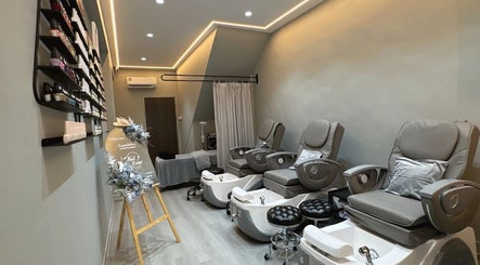 Relaxing interior of Nail Lounge in Singapore, Singapore, SG with plush pedicure chairs and elegant ambiance.