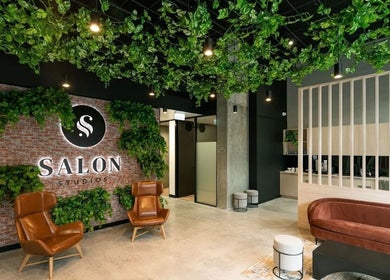Inside KC Hair/Kelvin of Canterbury, Melbourne, Victoria, AU. Stylish salon with lush greenery and modern design.