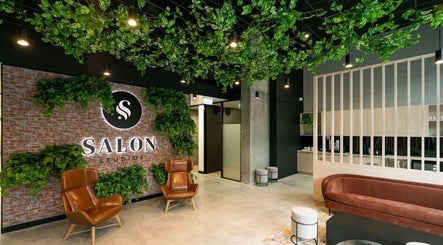Inside KC Hair/Kelvin of Canterbury, Melbourne, Victoria, AU. Stylish salon with lush greenery and modern design.