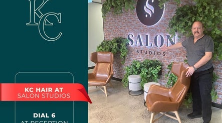 Modern seating area at KC Hair / Kelvin of Canterbury in Melbourne, Victoria, AU, with plants and stylish chairs.