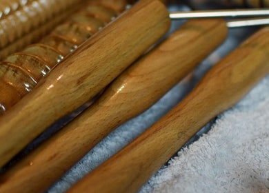 Massage tools at Tension Release Studio, Vancouver, British Columbia, CA, on a soft towel.