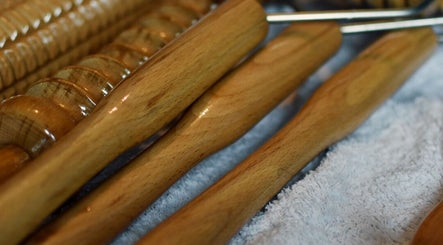 Massage tools at Tension Release Studio, Vancouver, British Columbia, CA, on a soft towel.