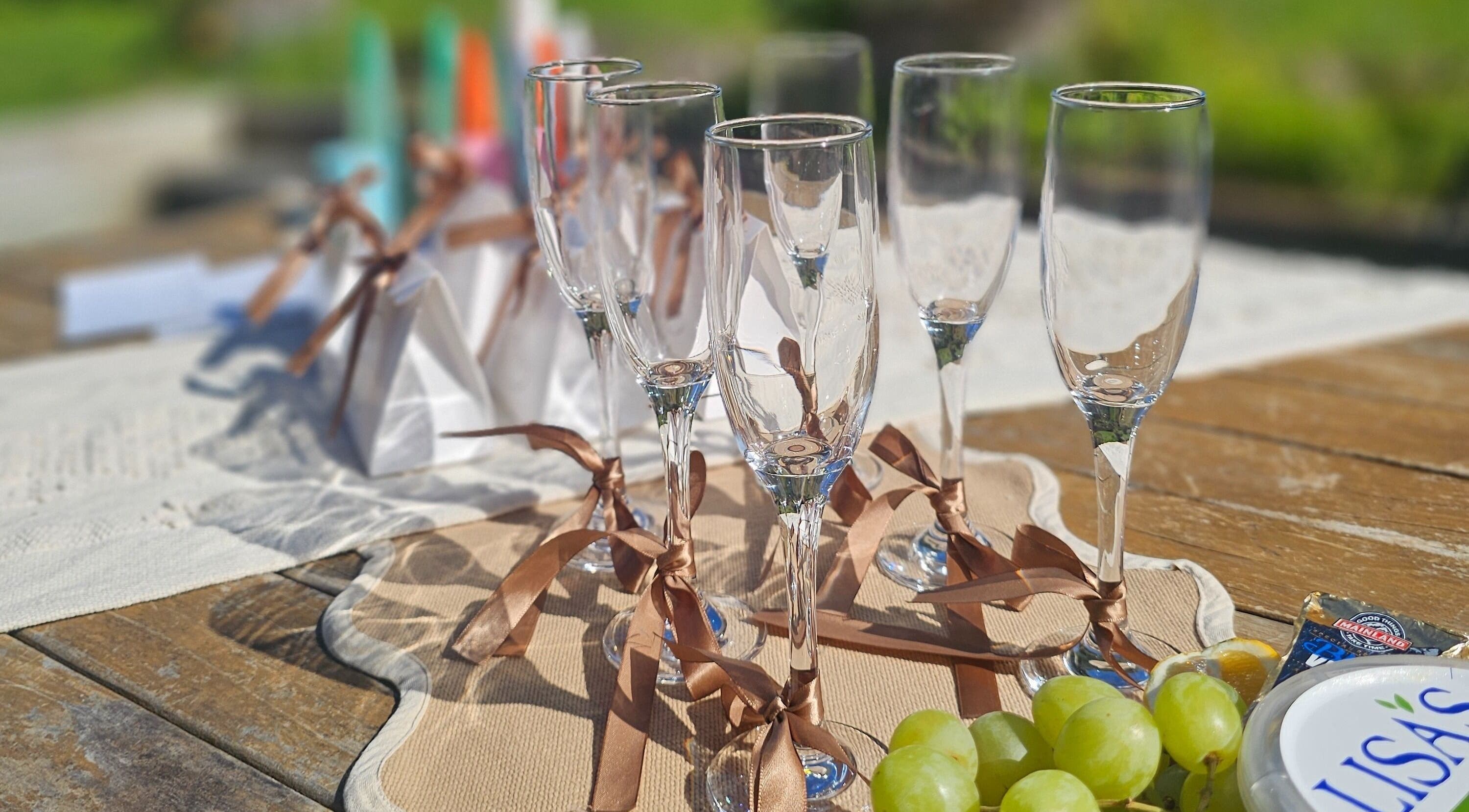 Elegant setting with champagne glasses at Tan Acres Mobile Spray Tanning, Whanganui, Manawatū-whanganui Region, NZ.