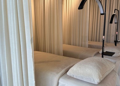 Cozy treatment beds with soft lighting at Volume 8, Auckland, Auckland, NZ, for a relaxing wellness experience.