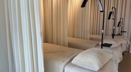 Cozy treatment beds with soft lighting at Volume 8, Auckland, Auckland, NZ, for a relaxing wellness experience.